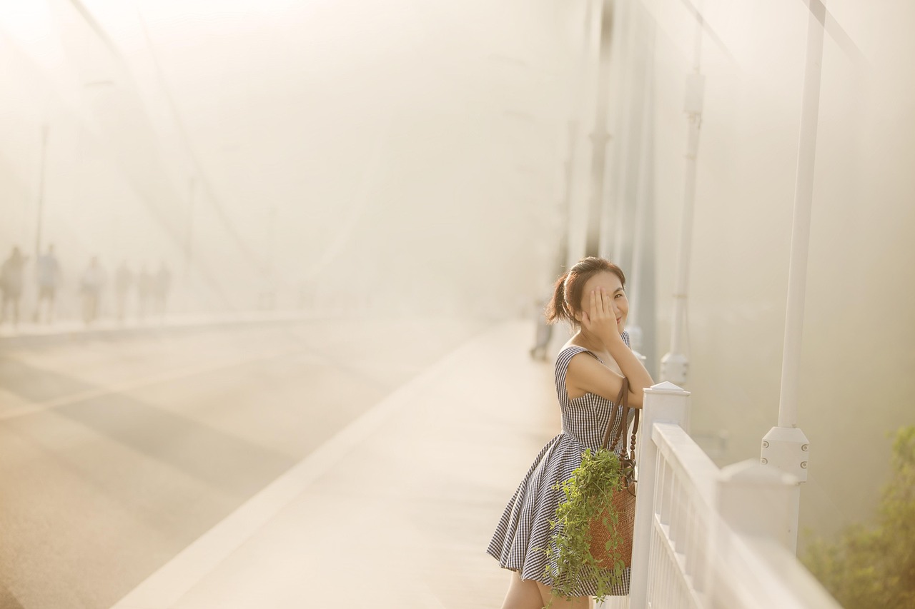 Woman, fog, bridge — HOW EXPENSIVE IS A ROLEX WATCH?